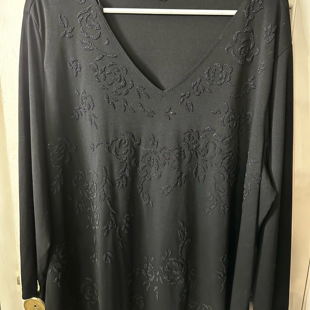 Long sleeve black top perfect for holiday parties or night on the town